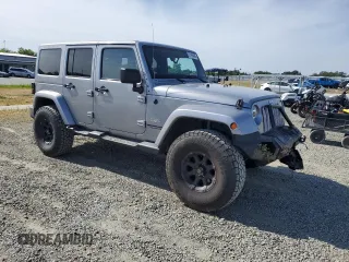 2014 Jeep Wrangler Unlimited Sahara with VIN 1C4HJWEG1EL126611, listed as a Copart auction lot 57169485 with 122,000 mi miles and Salvage title. Bid and sale history available at DreamBid. Image 4.
