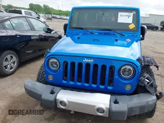 2015 Jeep Wrangler Sahara with VIN 1C4AJWBG9FL663959, listed as a IAAI auction lot 42133900 with 56,253 mi miles and . Bid and sale history available at DreamBid. Image 13.
