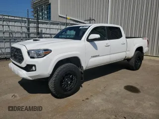 2018 Toyota Tacoma SR5 with VIN 5TFDZ5BN9JX035903, listed as a Copart auction lot 61175455 with 233,469 mi miles and Clean title. Bid and sale history available at DreamBid. Image 1.