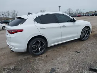 2020 Alfa Romeo Stelvio Ti with VIN ZASPAKBN6L7C92398, listed as a IAAI auction lot 41924883 with 73,683 mi miles. Bid and sale history available at carsss.com. Image 4.