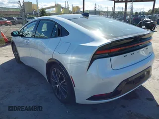 2023 Toyota Prius LE with VIN JTDACAAUXP3012538, listed as a IAAI auction lot 41948103 with 33,338 mi miles and . Bid and sale history available at DreamBid. Image 3.