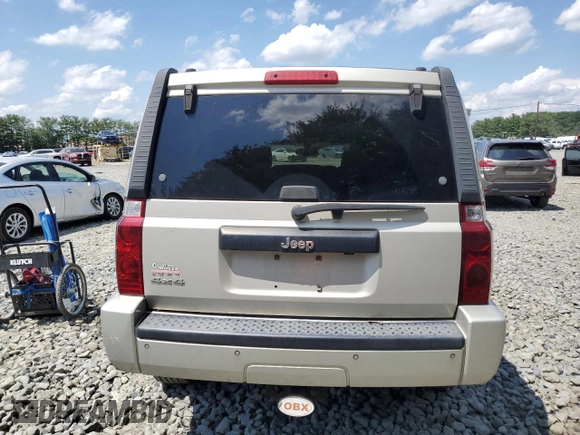 2007 Jeep Commander Sport z VIN 1J8HG48K67C651209, wystawiony jako Copart lot #64049035 z przebiegiem 216 628 mil mil oraz Szkoda całkowita • Salvage title. Historia ofert i sprzedaży dostępna na DreamBid. Obrazek 6.