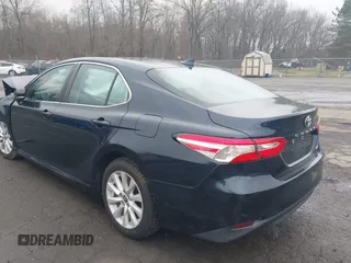 2020 Toyota Camry LE with VIN 4T1L11AK3LU977805, listed as a IAAI auction lot 41907558 with 82,237 mi miles and . Bid and sale history available at DreamBid. Image 3.