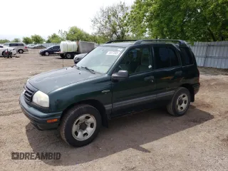 2003 Suzuki Vitara JLX z VIN 2S3TD52V136101732, wystawiony jako Copart lot #58477845 z przebiegiem 105 628 mil mil oraz Czysty tytuł • Clean title. Historia ofert i sprzedaży dostępna na DreamBid. Obrazek 1.