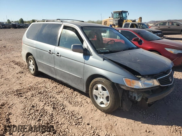 1999 Honda Odyssey EX with VIN 2HKRL1860XH541737, listed as a Copart auction lot 88897965 with 112,164 mi miles and Salvage title. Bid and sale history available at DreamBid. Image 4.