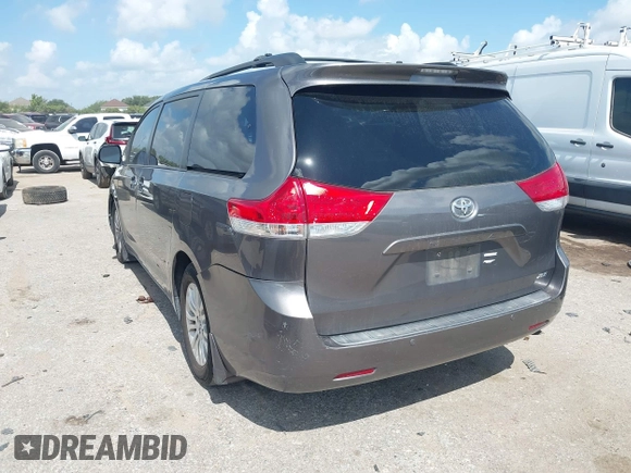 2014 Toyota Sienna XLE with VIN 5TDYK3DC0ES513076, listed as a IAAI auction lot 42724629 with 154,019 mi miles and . Bid and sale history available at DreamBid. Image 3.