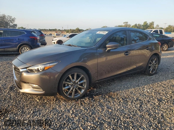 2018 Mazda 3 Touring z VIN 3MZBN1L33JM235106, wystawiony jako Copart lot #58272365 z przebiegiem 28 844 mil mil oraz Szkoda całkowita • Salvage title. Historia ofert i sprzedaży dostępna na DreamBid. Obrazek 1.
