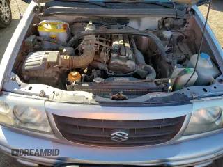 2003 Suzuki Vitara z VIN 2S3TE52V936103483, wystawiony jako Copart lot #82235884 z przebiegiem 173 354 mil mil oraz Szkody całkowita. Historia ofert i sprzedaży dostępna na DreamBid. Obrazek 11.