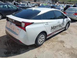 2021 Toyota Prius L Eco with VIN JTDKAMFU8M3133925, listed as a IAAI auction lot 41966660 with 115,193 mi miles. Bid and sale history available at carsss.com. Image 4.