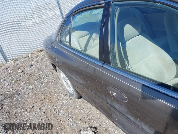 2001 Oldsmobile Intrigue GX z VIN 1G3WH52H11F148269, wystawiony jako IAAI lot #42238449 z przebiegiem Nie podano mil oraz . Historia ofert i sprzedaży dostępna na DreamBid. Obrazek 17.