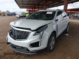 2021 Cadillac XT5 FWD Premium Luxury with VIN 1GYKNCRS5MZ224957, listed as a IAAI auction lot 41794648 with 28,540 mi miles and . Bid and sale history available at carsss.com. Image 2.