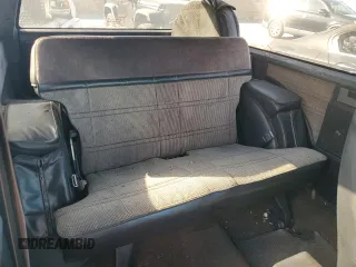 1988 GMC Jimmy z VIN 1GKCS18Z2J8541042, wystawiony jako Copart lot #78100004 z przebiegiem 199 916 mil mil oraz Czysty tytuł • Clean title. Historia ofert i sprzedaży dostępna na DreamBid. Obrazek 11.