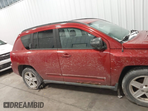 2010 Jeep Compass Sport with VIN 1J4NF4FB2AD506051, listed as a IAAI auction lot 41552084 with 218,785 mi miles. Bid and sale history available at carsss.com. Image 6.