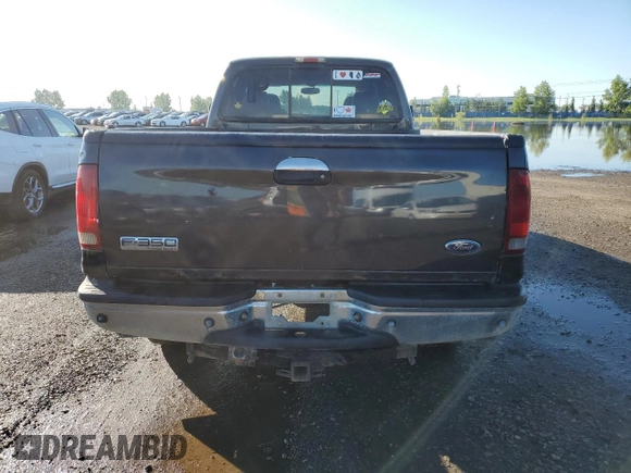 2005 Ford F-350 XL z VIN 1FTWW31P55EA45693, wystawiony jako Copart lot #66947005 z przebiegiem 193 308 mil mil oraz Czysty tytuł • Clean title. Historia ofert i sprzedaży dostępna na DreamBid. Obrazek 6.