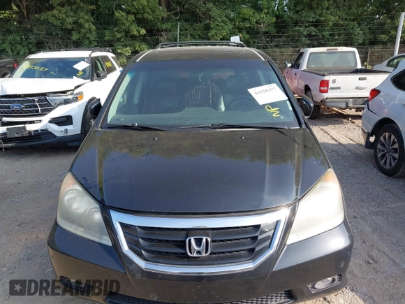 2010 Honda Odyssey Touring with VIN 5FNRL3H96AB031016, listed as a IAAI auction lot 42828397 with 261,881 mi miles and . Bid and sale history available at DreamBid. Image 6.