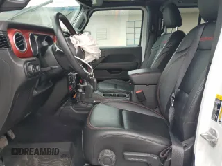2023 Jeep Wrangler Rubicon with VIN 1C4JJXFM3PW585720, listed as a Copart auction lot 59776305 with 19,190 mi miles and Salvage title. Bid and sale history available at DreamBid. Image 7.