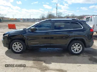 2014 Jeep Cherokee Latitude with VIN 1C4PJMCS6EW219999, listed as a IAAI auction lot 42044695 with 169,533 mi miles and . Bid and sale history available at carsss.com. Image 15.