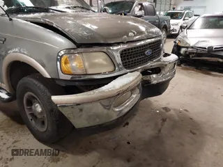 1999 Ford Expedition XLT z VIN 1FMPU18LXXLB47700, wystawiony jako IAAI lot #41592004 z przebiegiem Nie podano mil oraz . Historia ofert i sprzedaży dostępna na DreamBid. Obrazek 12.