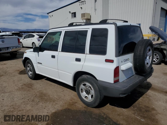 1996 Geo Tracker z VIN 2CNBE1364T6909947, wystawiony jako Copart lot #54411835 z przebiegiem 171 862 mil mil oraz Szkoda całkowita • Salvage title. Historia ofert i sprzedaży dostępna na DreamBid. Obrazek 2.