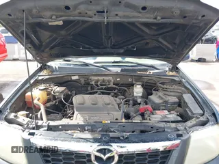2008 Mazda Tribute ES with VIN 4F2CZ06188KM01024, listed as a IAAI auction lot 41890148 with 122,367 mi miles. Bid and sale history available at carsss.com. Image 10.