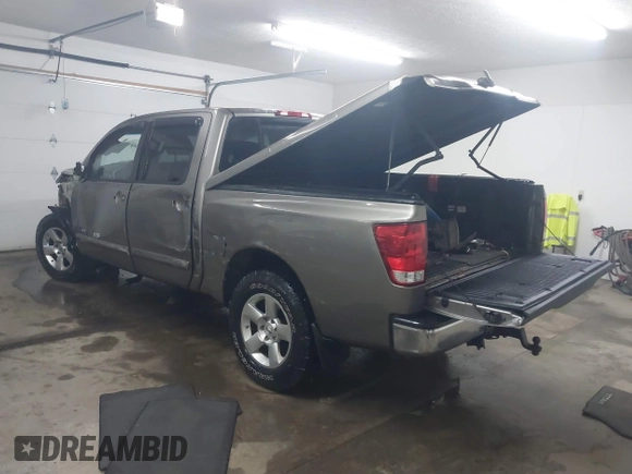 2006 Nissan Titan LE z VIN 1N6BA07B26N572273, wystawiony jako IAAI lot #41252390 z przebiegiem 88 457 mil mil oraz . Historia ofert i sprzedaży dostępna na DreamBid. Obrazek 3.