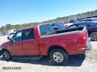 2001 Ford F-150 SuperCrew XLT with VIN 1FTRW07L11KE20412, listed as a IAAI auction lot 41877980 with 1 mi miles. Bid and sale history available at carsss.com. Image 13.