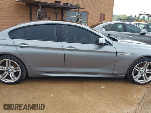 2016 BMW 6 Series 640i xDrive with VIN WBA6D2C58GGT66160, listed as a IAAI auction lot 41130666 with 102,064 mi miles and . Bid and sale history available at carsss.com. Image 14.
