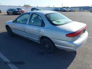 2000 Mercury Mystique z VIN 3MEFM6531YM604135, wystawiony jako IAAI lot #42148329 z przebiegiem 179 798 mil mil oraz . Historia ofert i sprzedaży dostępna na DreamBid. Obrazek 3.