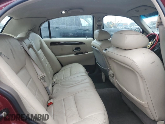 1999 Lincoln Town Car Signature with VIN 1LNHM82W7XY612906, listed as a Copart auction lot 50777435 with 110,414 mi miles and Salvage title. Bid and sale history available at DreamBid. Image 10.