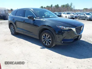 2023 Mazda CX-9 Touring z VIN JM3TCBCY1P0644397, wystawiony jako IAAI lot #41937972 z przebiegiem 26 757 mil mil oraz . Historia ofert i sprzedaży dostępna na DreamBid. Obrazek 1.