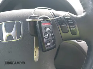 2010 Honda Odyssey EX-L with VIN 5FNRL3H70AB074913, listed as a IAAI auction lot 40142162 with 210,771 mi miles and . Bid and sale history available at DreamBid. Image 11.