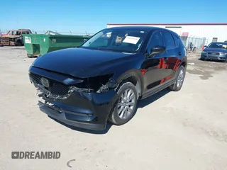 2020 Mazda CX-5 Grand Touring with VIN JM3KFBDMXL0763316, listed as a IAAI auction lot 41661958 with 64,881 mi miles and . Bid and sale history available at carsss.com. Image 18.