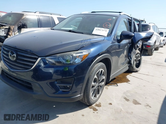 2016 Mazda CX-5 Grand Touring z VIN JM3KE2DY3G0797321, wystawiony jako IAAI lot #42017174 z przebiegiem 65 505 mil mil oraz . Historia ofert i sprzedaży dostępna na DreamBid. Obrazek 17.