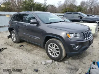 2015 Jeep Grand Cherokee Laredo with VIN 1C4RJFAG4FC627438, listed as a Copart auction lot 44078074 with 123,681 mi miles and Salvage Title. Bid and sale history available at carsss.com. Image 4.