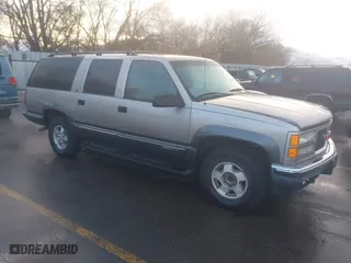 1999 GMC Suburban with VIN 1GKFK16R4XJ799354, listed as a IAAI auction lot 41696999 with 269,606 mi miles. Bid and sale history available at carsss.com. Image 1.