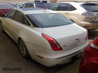 2013 Jaguar XJ with VIN SAJWJ1CD7D8V49599, listed as a Copart auction lot 54008915 with 133,163 mi miles and Clean Title. Bid and sale history available at carsss.com. Image 3.