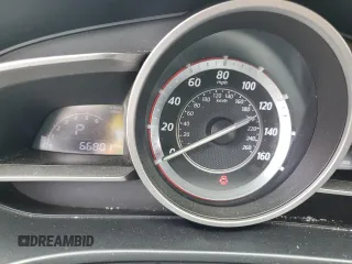 2015 Mazda 3 i Grand Touring z VIN 3MZBM1W78FM170908, wystawiony jako Copart lot #61169875 z przebiegiem 66 801 mil mil oraz Szkoda całkowita • Salvage title. Historia ofert i sprzedaży dostępna na DreamBid. Obrazek 9.