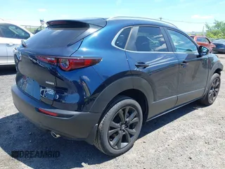 2024 Mazda CX-30 S Select Sport with VIN 3MVDMBBM2RM657781, listed as a IAAI auction lot 42297311 with 13,677 mi miles and . Bid and sale history available at DreamBid. Image 4.