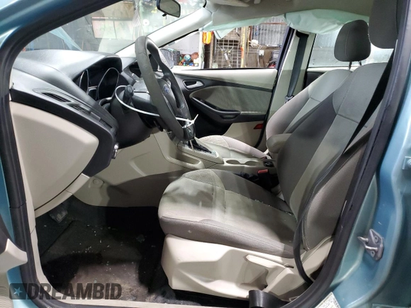 2012 Ford Focus SE with VIN 1FAHP3F27CL149328, listed as a Copart auction lot 56000325 with 147,097 mi miles and Salvage Title. Bid and sale history available at DreamBid. Image 7.
