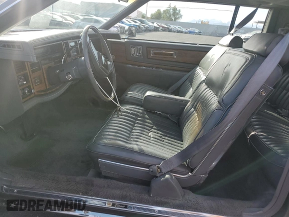 1985 Cadillac Eldorado z VIN 1G6EL5786FE628861, wystawiony jako Copart lot #76372384 z przebiegiem 15 146 mil mil oraz Szkody całkowita. Historia ofert i sprzedaży dostępna na DreamBid. Obrazek 7.