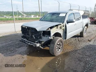 2021 Toyota Tacoma SR with VIN 5TFCZ5AN7MX255512, listed as a IAAI auction lot 42497907 with 50,563 mi miles and . Bid and sale history available at DreamBid. Image 2.