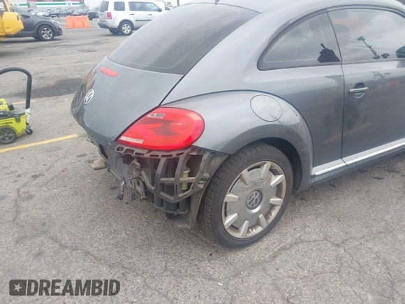 2013 Volkswagen Beetle 2.5L with VIN 3VWJP7AT6DM667477, listed as a IAAI auction lot 42215545 with 87,392 mi miles and . Bid and sale history available at DreamBid. Image 4.