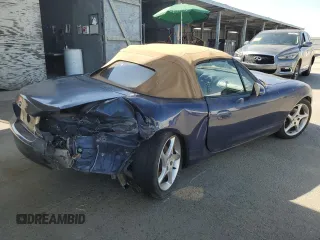 2002 Mazda MX-5 Miata Cloth z VIN JM1NB353220222868, wystawiony jako Copart lot #59944345 z przebiegiem 159 595 mil mil oraz Szkoda całkowita • Salvage title. Historia ofert i sprzedaży dostępna na DreamBid. Obrazek 3.