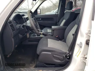 2010 Jeep Liberty Sport with VIN 1J4PP2GK9AW133958, listed as a Copart auction lot 47265675 with 124,466 mi miles and Salvage Title. Bid and sale history available at DreamBid. Image 7.