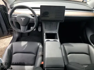 2023 Tesla Model Y Long Range z VIN 7SAYGDEE3PF884220, wystawiony jako Copart lot #52072605 z przebiegiem 44 996 mil mil oraz Czysty tytuł • Clean title. Historia ofert i sprzedaży dostępna na DreamBid. Obrazek 8.