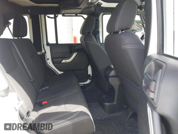 2017 Jeep Wrangler Unlimited Sahara with VIN 1C4BJWEG8HL734572, listed as a IAAI auction lot 41863636 with 123,979 mi miles. Bid and sale history available at carsss.com. Image 8.