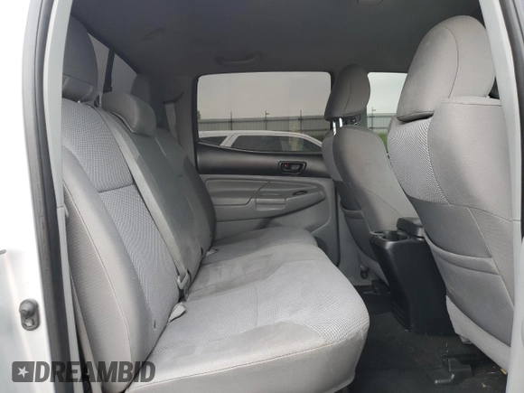 2012 Toyota Tacoma z VIN 3TMLU4EN6CM093217, wystawiony jako Copart lot #60237655 z przebiegiem 184 205 mil mil oraz Czysty tytuł • Clean title. Historia ofert i sprzedaży dostępna na DreamBid. Obrazek 10.