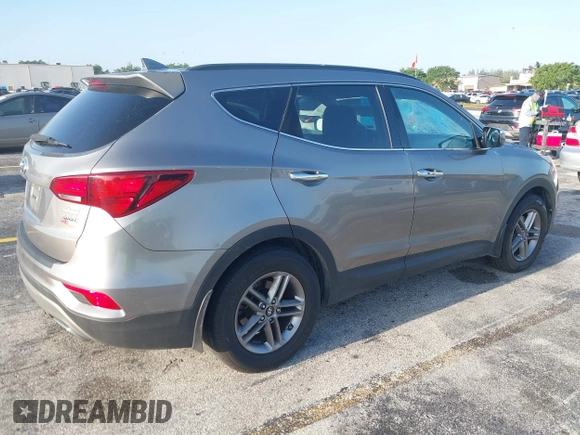 2017 Hyundai Santa Fe 2.4L z VIN 5XYZU3LB0HG420910, wystawiony jako IAAI lot #42017552 z przebiegiem 184 666 mil mil oraz . Historia ofert i sprzedaży dostępna na DreamBid. Obrazek 4.