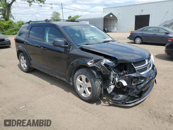 2013 Dodge Journey SE with VIN 3C4PDCAB0DT500365, listed as a Copart auction lot 61033665 with 193,231 mi miles and Salvage title. Bid and sale history available at DreamBid. Image 4.