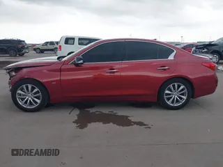 2014 Infiniti Q50 Premium z VIN JN1BV7AP8EM673359, wystawiony jako IAAI lot #42300427 z przebiegiem 118 779 mil mil oraz . Historia ofert i sprzedaży dostępna na DreamBid. Obrazek 14.